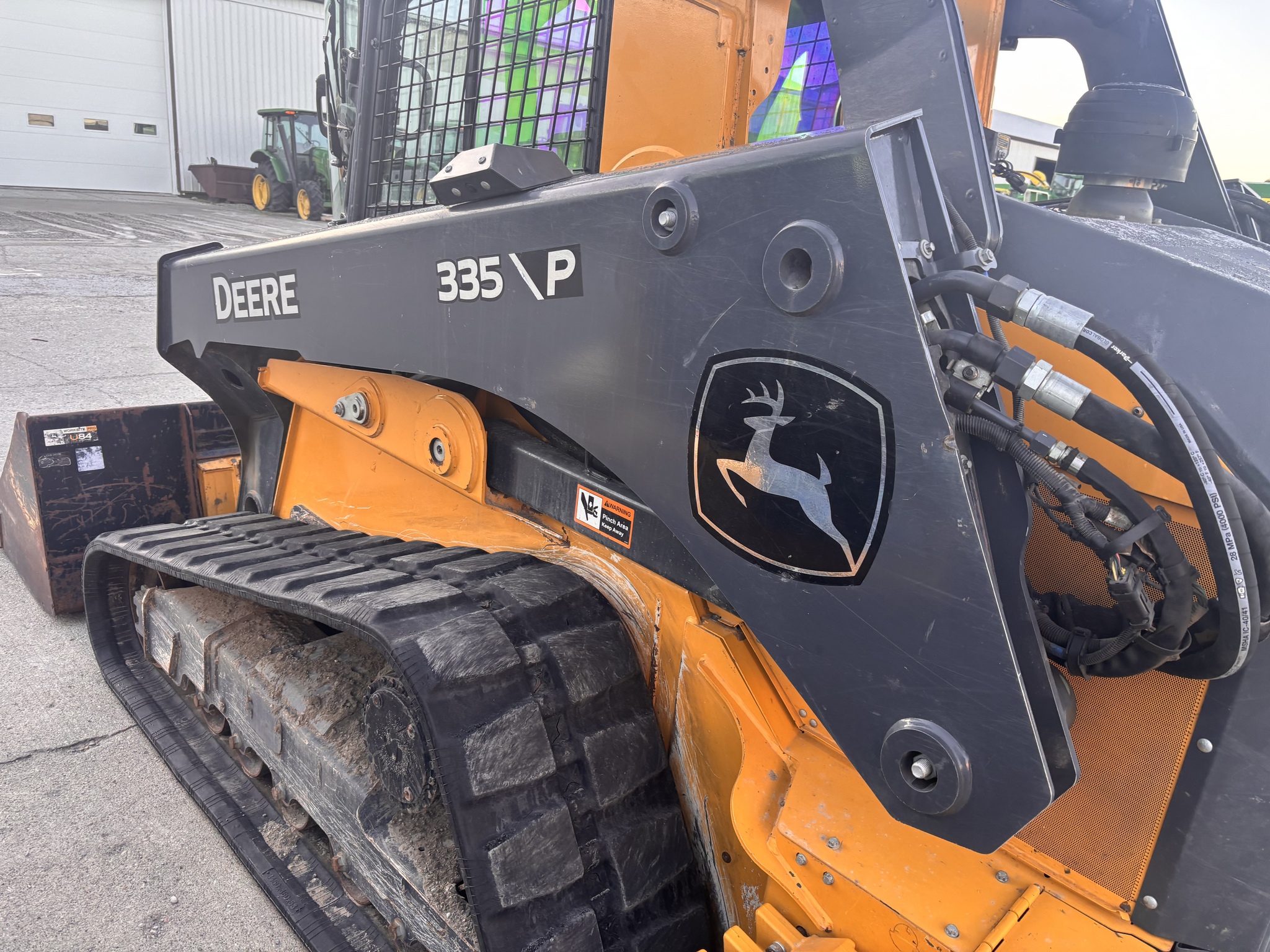 On Lot 2024 John Deere 335 P at Tri County Equipment Sandusky, MI